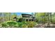 House nestled in woods with large deck and screened porch at 500 Augusta Ln, Chattahoochee Hills, GA 30268