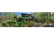 House nestled in woods with large deck and screened porch at 500 Augusta Ln, Chattahoochee Hills, GA 30268