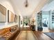 Long hallway featuring hardwood floors and artwork at 500 Augusta Ln, Chattahoochee Hills, GA 30268
