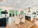 Kitchen with a round dining table and chairs, open to the living room at 500 Augusta Ln, Chattahoochee Hills, GA 30268
