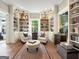 Cozy library with built-in bookshelves and comfy armchairs at 500 Augusta Ln, Chattahoochee Hills, GA 30268