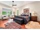 Spacious main bedroom with hardwood floors and sitting area at 500 Augusta Ln, Chattahoochee Hills, GA 30268