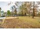 Large backyard with patio, fire pit, and wooded area at 2994 Meadow Wood Ct, Lawrenceville, GA 30044