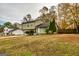 Green two-story house with a spacious yard and a fenced area at 2994 Meadow Wood Ct, Lawrenceville, GA 30044