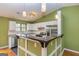 Stylish kitchen boasting stainless steel appliances and a breakfast bar at 2994 Meadow Wood Ct, Lawrenceville, GA 30044