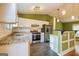 Modern kitchen featuring stainless steel appliances and granite countertops at 2994 Meadow Wood Ct, Lawrenceville, GA 30044