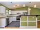 Updated kitchen with stainless steel appliances and a breakfast bar at 2994 Meadow Wood Ct, Lawrenceville, GA 30044