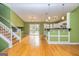 Spacious living area with hardwood floors and a view of the kitchen at 2994 Meadow Wood Ct, Lawrenceville, GA 30044