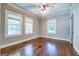 Bedroom with hardwood floors and multiple windows at 3127 Mill Se St, Covington, GA 30014