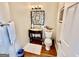 Small bathroom with granite vanity and decorative mirror at 7631 Garland Cir # 4, South Fulton, GA 30349