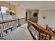 Elegant upstairs hall with chandelier and wrought iron railings at 7631 Garland Cir # 4, South Fulton, GA 30349