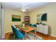 Charming dining room with hardwood floors and mid century modern furniture at 172 Twiggs Cor, Peachtree City, GA 30269