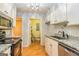 Galley kitchen with granite countertops and stainless steel appliances at 172 Twiggs Cor, Peachtree City, GA 30269