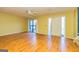 Hardwood floor living room with sliding door to the patio at 172 Twiggs Cor, Peachtree City, GA 30269
