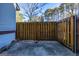 Private patio with wood fence and gravel landscaping at 172 Twiggs Cor, Peachtree City, GA 30269