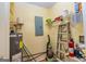 A well-lit utility room with shelving, water heater, and electrical panel at 172 Twiggs Cor, Peachtree City, GA 30269