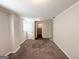 Bright basement with neutral walls, carpet, and doors leading to other rooms at 4785 Kent Rd, Atlanta, GA 30337