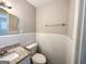 Clean bathroom with white tile and a granite vanity top at 4785 Kent Rd, Atlanta, GA 30337