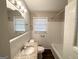 Updated bathroom with granite countertops and white tile at 4785 Kent Rd, Atlanta, GA 30337