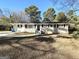 Newly renovated brick ranch home with a landscaped yard at 4785 Kent Rd, Atlanta, GA 30337