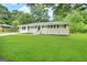 Ranch style home with a large front yard and mature trees at 4785 Kent Rd, Atlanta, GA 30337