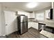 Updated kitchen featuring white cabinets, granite countertops and stainless steel appliances at 4785 Kent Rd, Atlanta, GA 30337