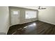 Bright living room featuring hardwood floors and a classic aesthetic at 4785 Kent Rd, Atlanta, GA 30337
