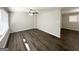 Spacious living room with dark laminate floors and lots of natural light at 4785 Kent Rd, Atlanta, GA 30337