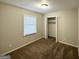 Simple bedroom with neutral walls and carpeted floors at 2318 Emerald Falls Dr, Decatur, GA 30035