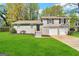 Gray brick ranch house with 2-car garage and landscaped lawn at 2318 Emerald Falls Dr, Decatur, GA 30035