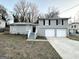 Newly painted gray brick ranch house with a 2-car garage at 2318 Emerald Falls Dr, Decatur, GA 30035