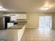 Kitchen features granite countertops and white cabinets at 2318 Emerald Falls Dr, Decatur, GA 30035