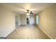 Spacious living room with tile floors and ceiling fan at 2318 Emerald Falls Dr, Decatur, GA 30035