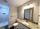 Clean bathroom with granite vanity and a large mirror at 4303 Mercer Rd, Decatur, GA 30035