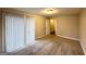 Bedroom with brick accent wall, carpet, and sliding door access at 4303 Mercer Rd, Decatur, GA 30035