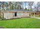 Brick ranch house with a carport and a well-maintained lawn at 4303 Mercer Rd, Decatur, GA 30035