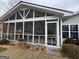 Spacious screened porch with ceiling fan and outdoor seating area at 3649 Pinehill Cir, Acworth, GA 30101