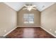 Well lit bedroom with hardwood floors and a ceiling fan at 401 Stoneridge Ct, Mcdonough, GA 30253