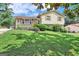 Two-story house with brick and siding, a sloping lawn, and a driveway at 214 W Windemere Way, Jonesboro, GA 30238