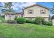 Two-story house with brick and siding, a sloping lawn, and a driveway at 214 W Windemere Way, Jonesboro, GA 30238