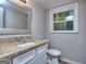 Simple bathroom with granite countertop vanity and toilet at 3031 Golden Dr, East Point, GA 30344