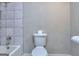 Clean bathroom with a shower/tub combo and marble tile at 3031 Golden Dr, East Point, GA 30344