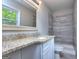 Bathroom with granite vanity, a shower, and an updated look at 3031 Golden Dr, East Point, GA 30344