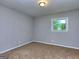 Bright bedroom with neutral walls and carpeting, featuring a window at 3031 Golden Dr, East Point, GA 30344