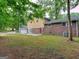 Brick ranch house with attached garage and spacious backyard at 3031 Golden Dr, East Point, GA 30344