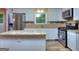 Updated kitchen with granite countertops and white cabinets at 3031 Golden Dr, East Point, GA 30344
