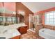 Bathroom with double sinks, shower, and bathtub at 5539 Halsey Trce, Atlanta, GA 30349
