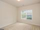 Simple bedroom with window and neutral decor at 5539 Halsey Trce, Atlanta, GA 30349