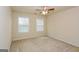 Well-lit bedroom with two windows and ceiling fan at 5539 Halsey Trce, Atlanta, GA 30349
