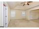 Large bedroom with ceiling fan and carpet flooring at 5539 Halsey Trce, Atlanta, GA 30349